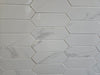 Marmo Julieta polished/matte porcelain tile in a soft white marble style, for floors and walls. In a hexagon mosaic.