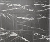 Marquina matte porcelain tile with a black and busy white vein pattern, for floors and walls. In a 12x24" size.