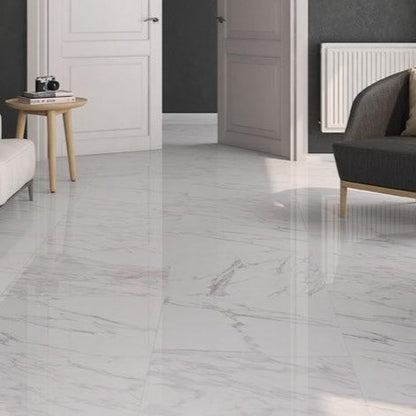 Klipper glossy porcelain tile with a white marble design, for floors and walls. Made in Spain, installed in a room.