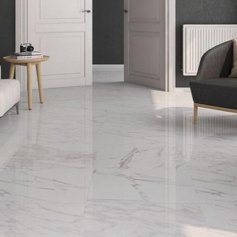 Klipper glossy porcelain tile with a white marble design, for floors and walls. Made in Spain, installed in a room.