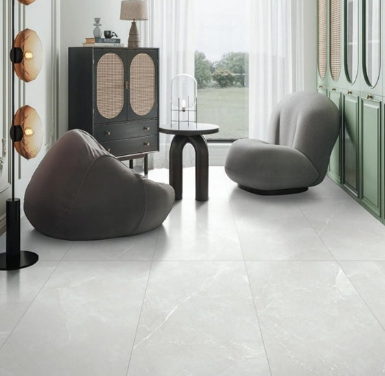 Minerva Grey polished and matte porcelain tile in a grey marble style, for floors and walls. Installed in a room.