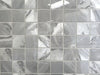 Morocco Ash Grey porcelain mosaic with a grey marble style, for floors and walls. In a square shape.