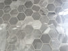 Morocco Ash Grey porcelain mosaic with a grey marble style, for floors and walls. In a small hexagon shape.