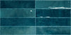 Nairobi Blue artisan style glossy ceramic subway tile with non-flat edge and surface. Made in Spain, in a 3x12" size.