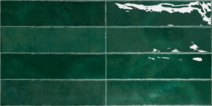 Nairobi Green artisan style glossy ceramic subway tile with non-flat edge and surface. Made in Spain, in a 3x12" size.