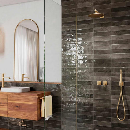Nairobi Slate artisan style glossy ceramic subway tile with non-flat edge and surface. Made in Spain, in a 3x12" size.