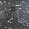 Nero Marquina polished porcelain tile with black marble design, for floors and walls. In a 24x24" size.