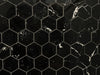 Nero Marquina polished porcelain mosaic with a black marble style, for floors and walls. In a small hexagon shape.