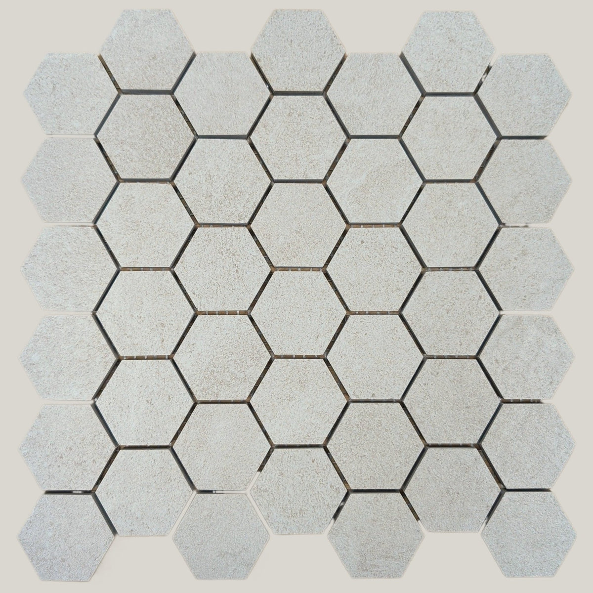 Nordic Chalk matte porcelain mosaic with a white/off-white stone look, for floors and walls. In a small hexagon size.
