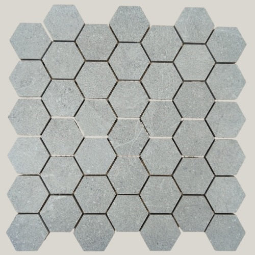 Nordic Grigio matte porcelain tile with a light grey stone look, for floors and walls. In a small hexagon size.
