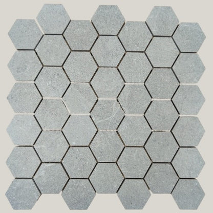Nordic Grigio matte porcelain tile with a light grey stone look, for floors and walls. In a small hexagon size.