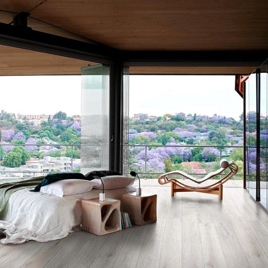 Oltre White matte porcelain tile with a wood design, for floors and walls. Made in Italy, installed in a room.