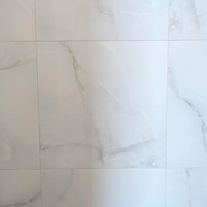 Onice Grigio polished porcelain tile with a grey onyx design, for floors and walls. In a 24x24" size.