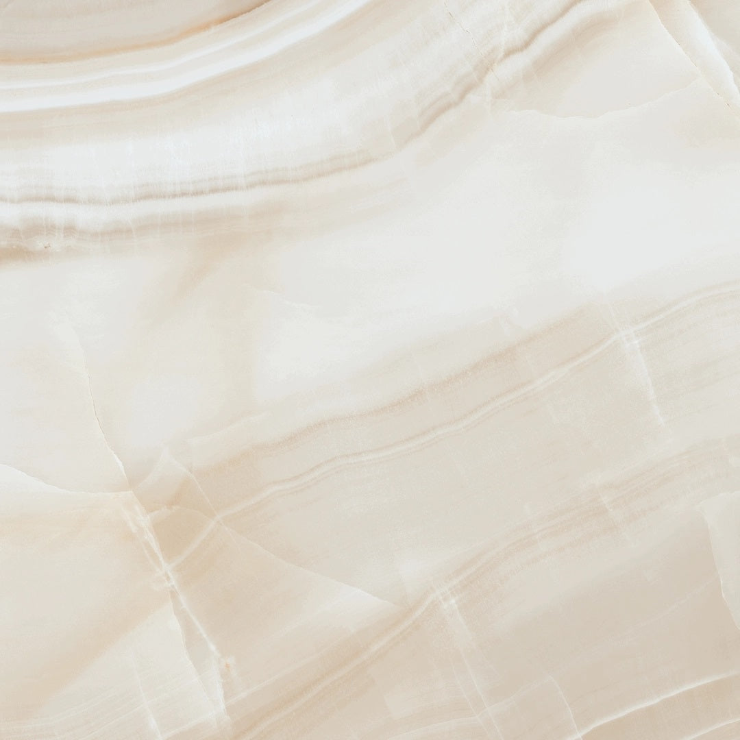 Onice Light Beige glossy porcelain tile with an onyx design, for floors and walls. Made in Spain, in a 24x24" size.