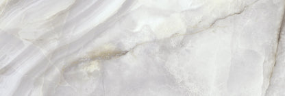 Onice Perla glossy ceramic tile with a grey onyx design, for walls. Made in Spain, in a 12x36" size.
