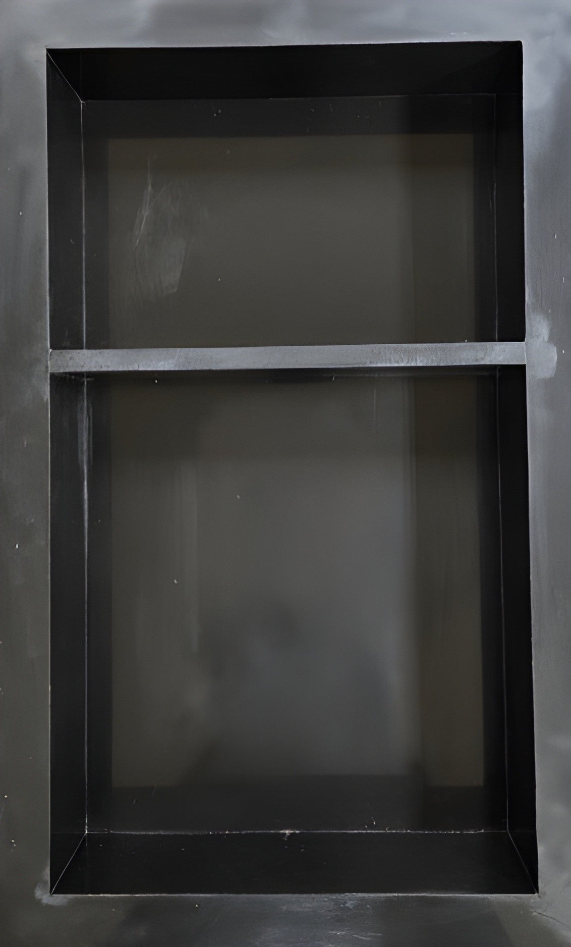 Pure Black prebuilt quartz shower niche made of engineered stone that offers shower storage, with a shelf.