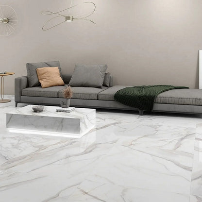 Radiant Calacatta porcelain tile with a white and grey marble design, for floors and walls. Installed in a room.