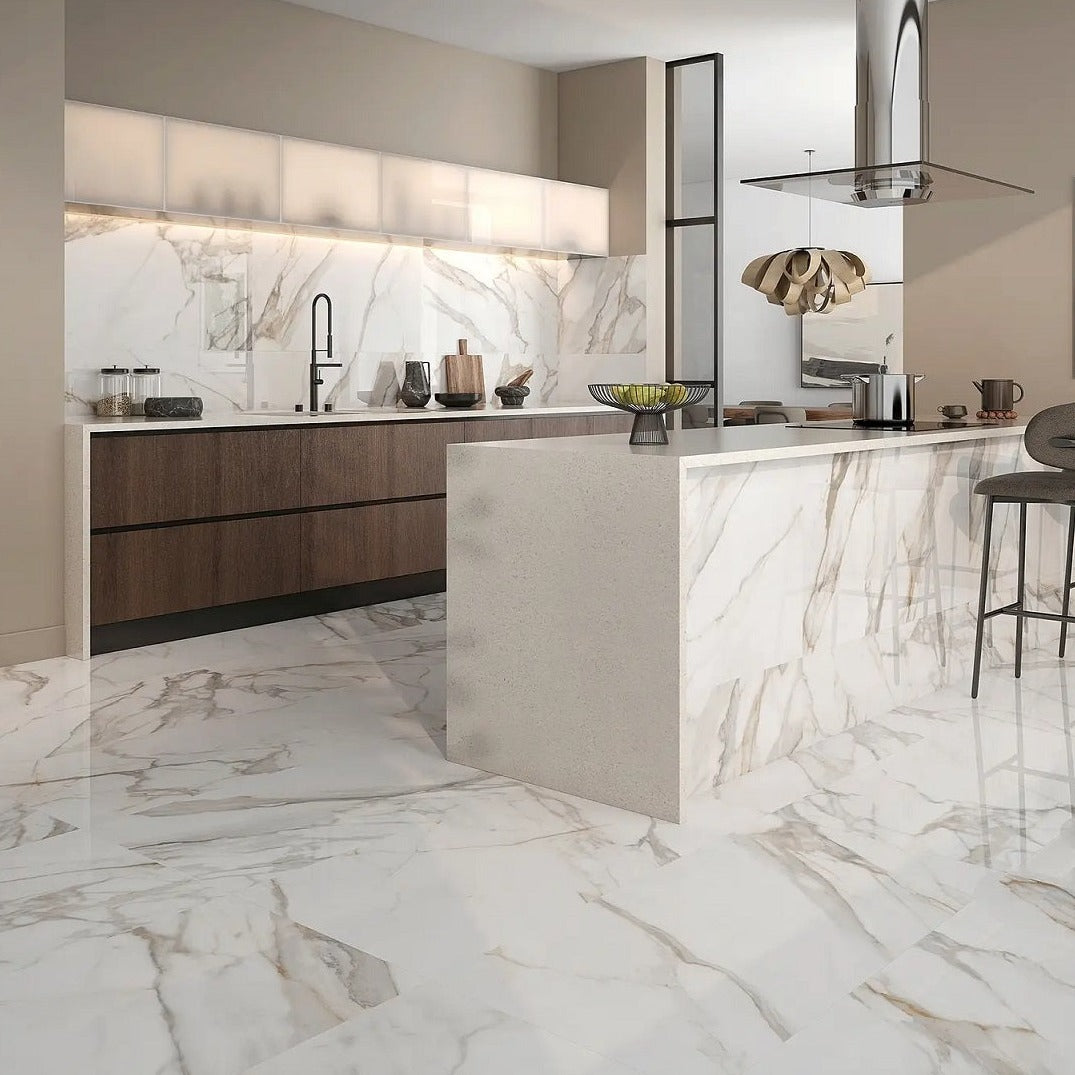 Radiant Calacatta porcelain tile with a white and grey marble design, for floors and walls. Installed in a room.