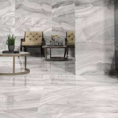 Rodas Perla polished porcelain tile with a grey onyx design, for floors and walls. Made in Spain, installed in a room.