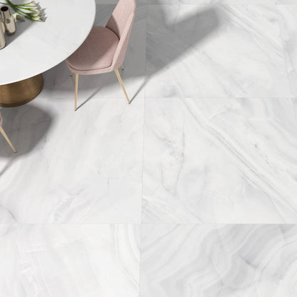 Rodas White polished porcelain tile with an onyx design, for floors and walls. Made in Spain, installed in a room.