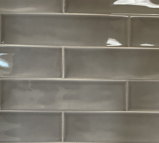 Selkis Tobacco glossy ceramic subway tile with a brown/grey solid colour, for walls. Made in Spain, in a 3x12" size.