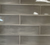 Selkis Tobacco glossy ceramic subway tile with a brown/grey solid colour, for walls. Made in Spain, in a 3x12" size.