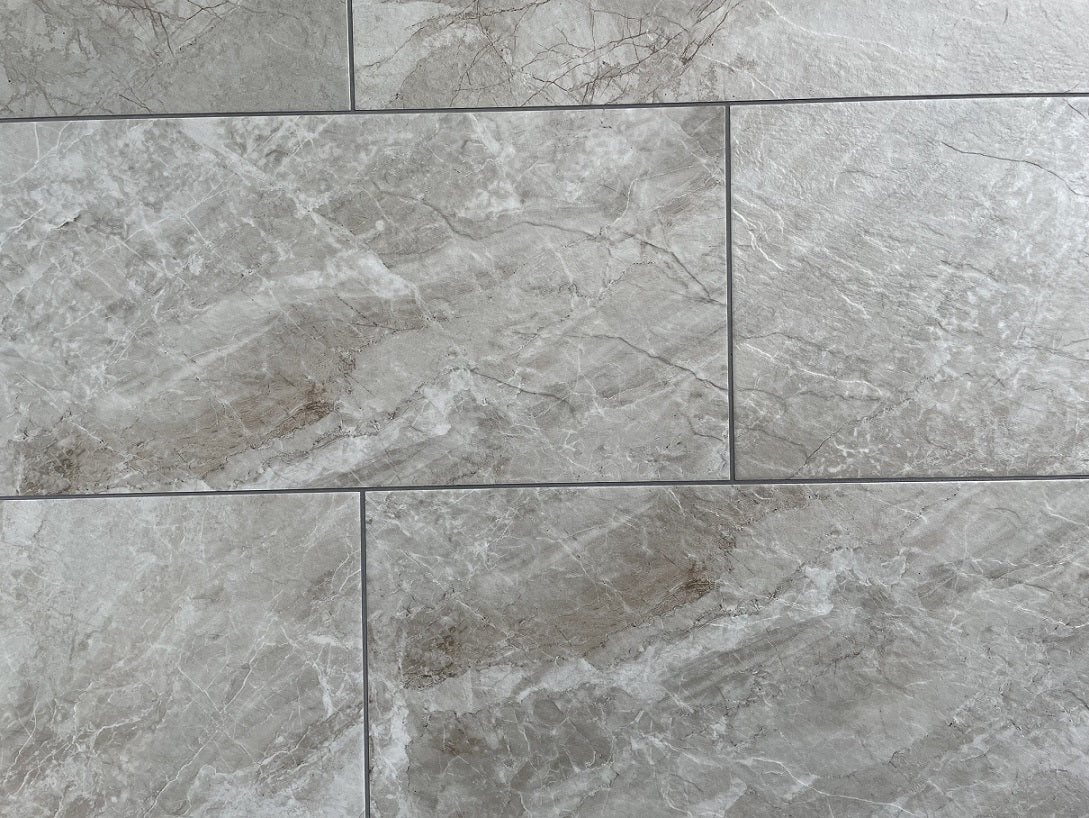 Sonoma Sky matte porcelain tile with a grey stone design, for floors and walls. Made in Italy, in a 12x24" size.