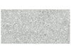 Station Ash matte porcelain tile with a grey terrazzo pebble style. In a 12x24" size.