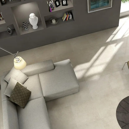 Stonework White matte porcelain tile with a stone design, for floors and walls. Made in Italy, installed in a room.