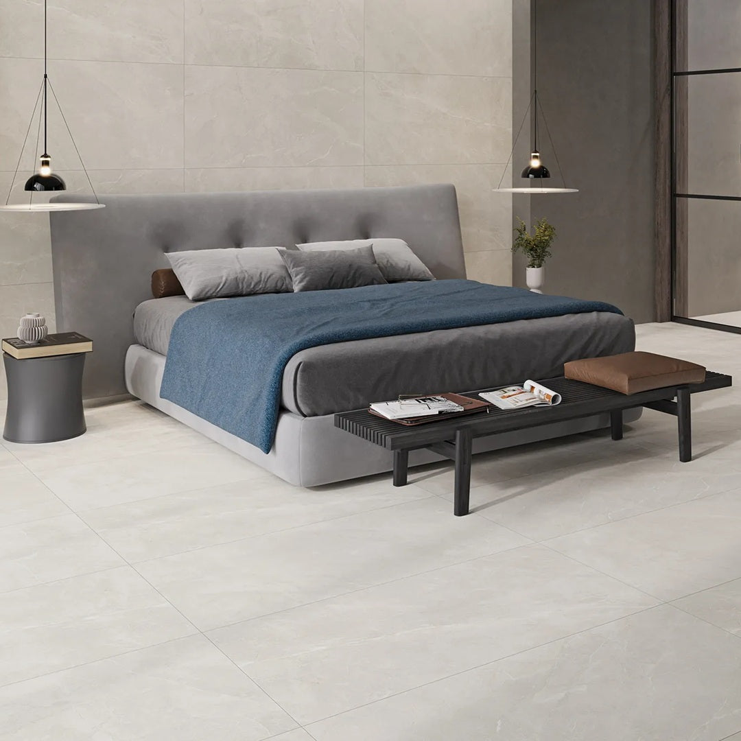 Sunset White porcelain tile with a cream marble design, for floors and walls. Made in Spain, installed in a room.