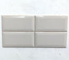Tender Grey glossy ceramic subway tile for walls. In a 3x6" size with a beveled edge.