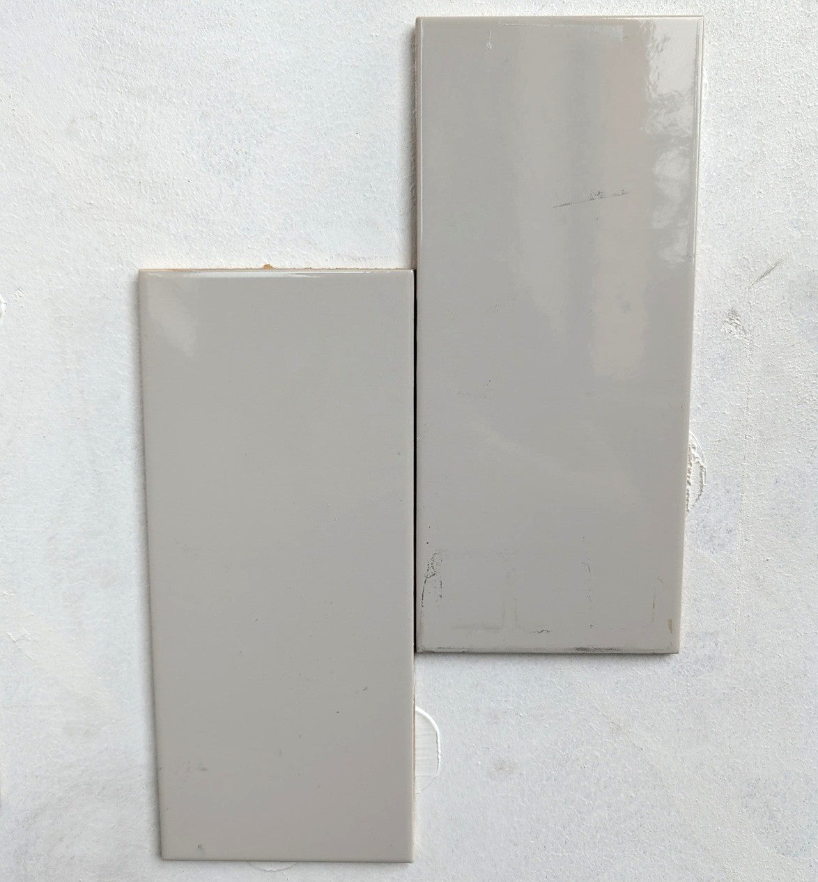 Tender Grey glossy ceramic subway tile for walls. In a 4.5x10" size.