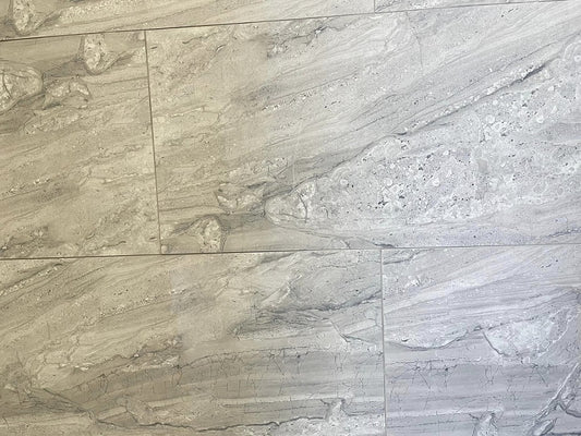 Tuscan Moon polished porcelain tile with a grey stone design, for floors and walls. In a 12x24" size.