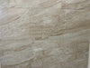 Tuscan Sun polished porcelain tile with a beige stone design, for floors and walls. In a 12x24" size.
