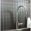Vintage Shadow pure dark grey square porcelain mosaic, for floors and walls. Installed on a backsplash.