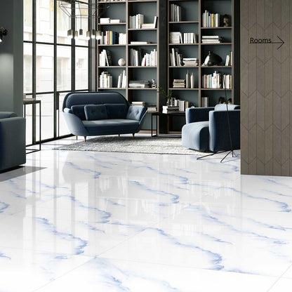 Vinyola Blue polished porcelain tile with a white and blue marble design, for floors and walls. Installed in a room.