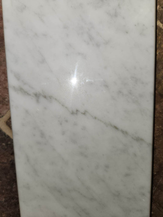 White Carrara marble shower arch in a 6x76" or 6x94.5" size.