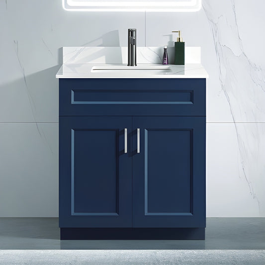 30 inch wood bathroom vanity in a blue colour with a carrara quartz top and brushed nickel hardware. With two doors.